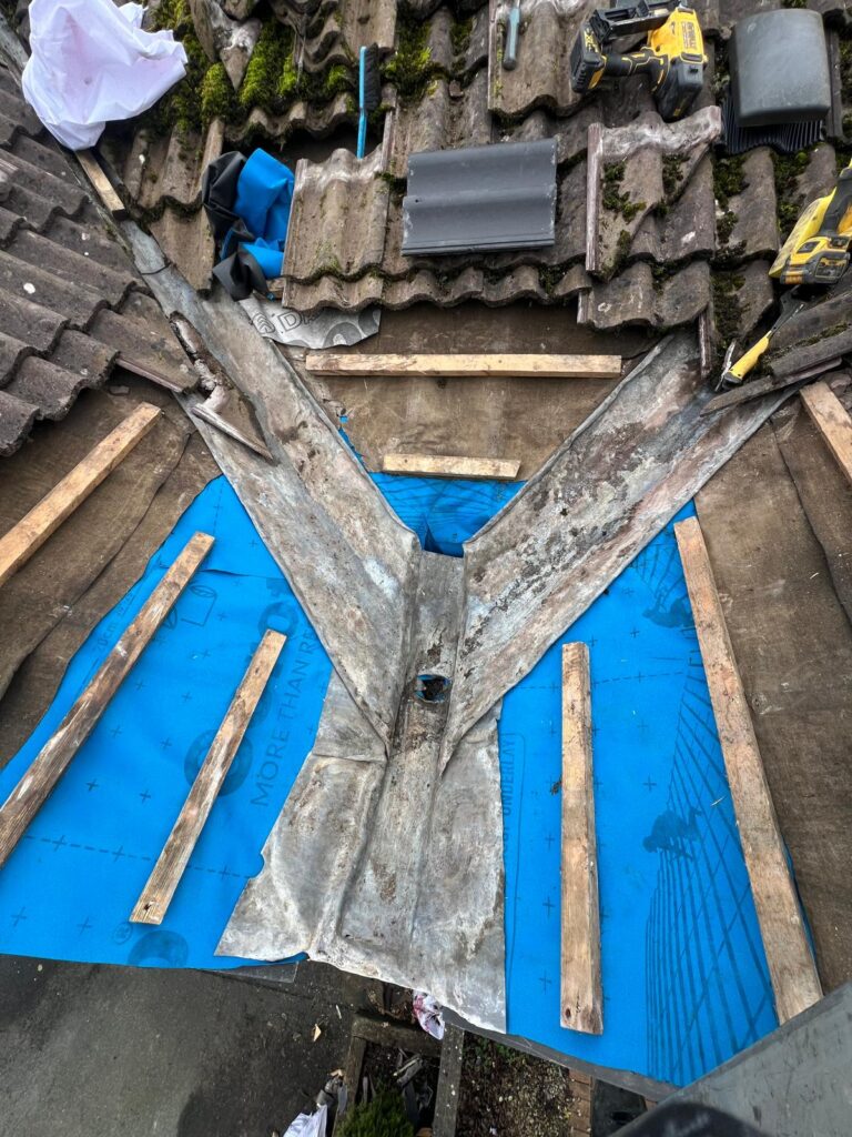 damaged roof valley removal repair.jpg